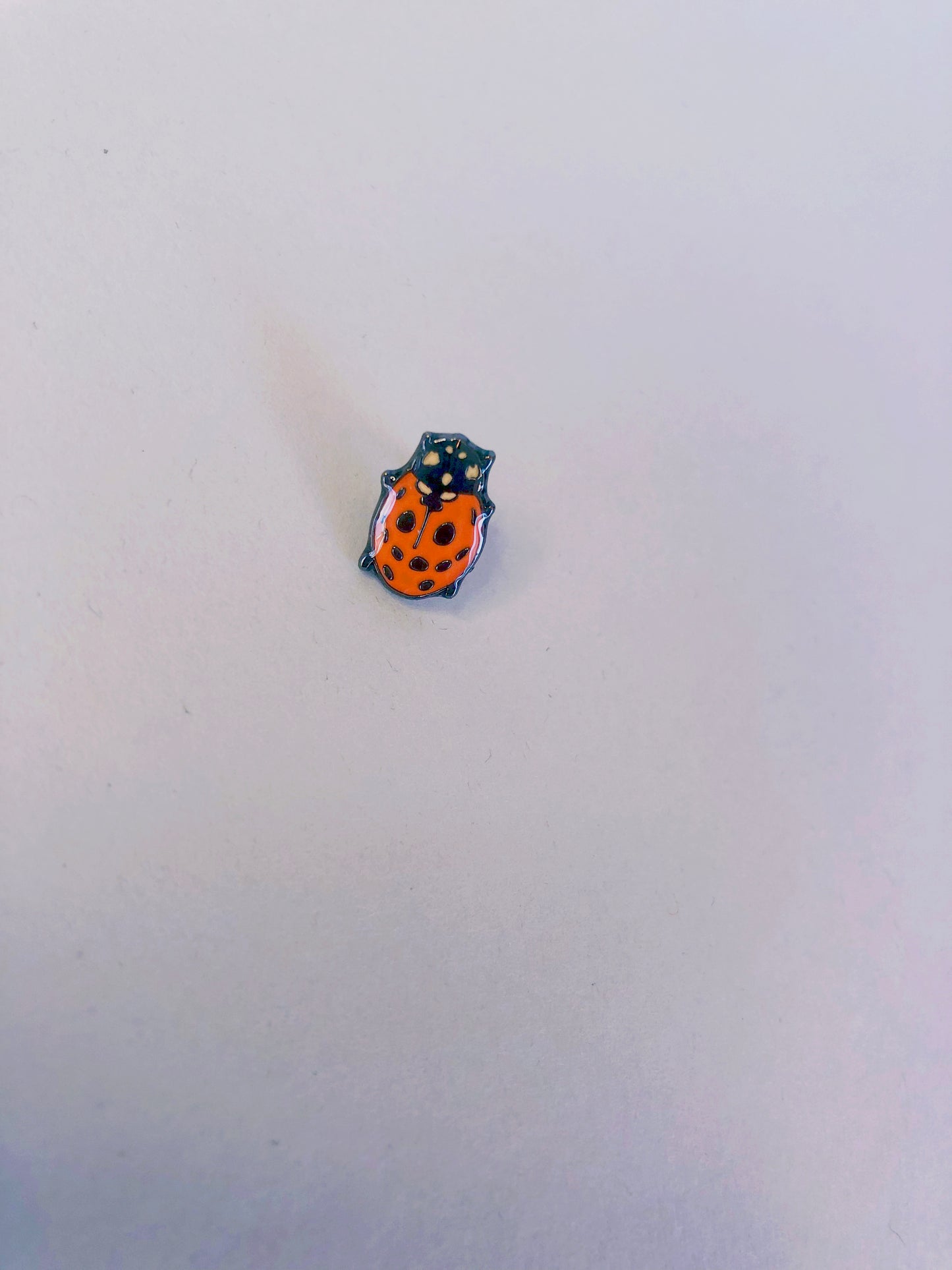 That ladybug, can you see it smiling? Enamel Pin